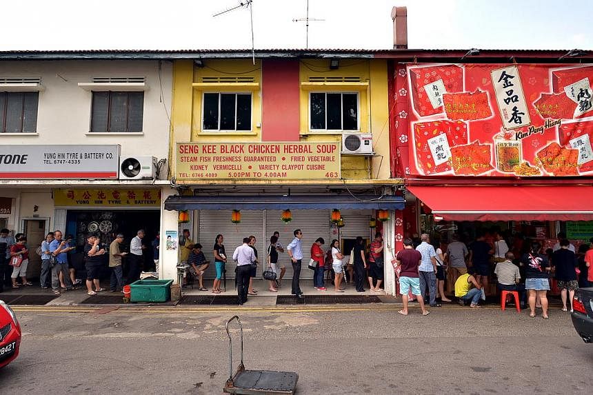 A 15 metre long queue forms outside Kim Peng Hiang bak kwa stall on Feb 11, 2015. Every year, Singapore's inflation has usually ticked up in the weeks before Chinese New Year, partly because of the higher prices of the beloved bak kwa, or barbecued p