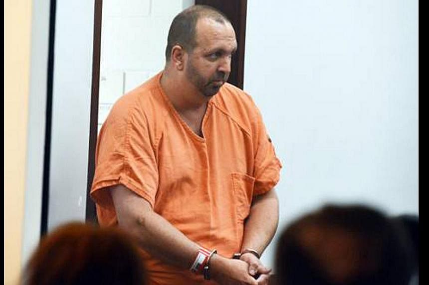 Craig Stephen Hicks, 46, enters the courtroom for his first appearance at the Durham County Detention Center in Durham, North Carolina on Feb 11. Hicks, of Chapel Hill, is charged with killing three Muslim students near the University of North Caroli