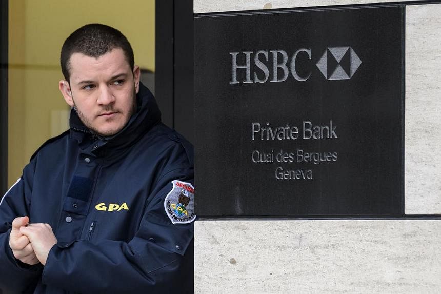 A private security guard secures the entrance of the HSBC Private Bank branch in Geneva on Feb 18, 2015. Ten days after a massive tax fraud scandal erupted surrounding British banking giant HSBC's Swiss branch, Swiss prosecutors announced a money lau