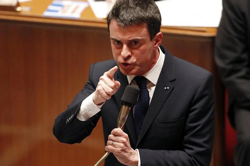 French Prime Minister Manuel Valls gestures as he speaks at the National Assembly in Paris Feb 17, 2015.&nbsp;The French government said on Tuesday it was passing President Francois Hollande's flagship economic reform Bill by decree, a rare move take