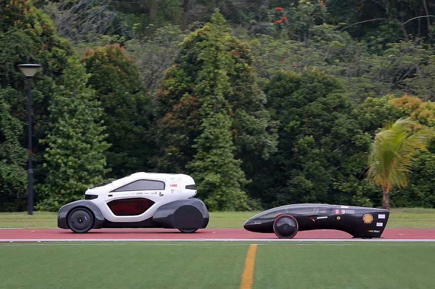 Nanyang Technological University's two new solar electric cars that will take part in the Shell Eco-marathon in Manila. -- ST PHOTO: ONG WEE JIN&nbsp;