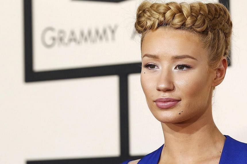 Rapper Iggy Azalea, who has built a fan base through social media but frequently engaged in bitter feuds, says she's taking a break from the Internet and its "pettiness." -- PHOTO: REUTERS