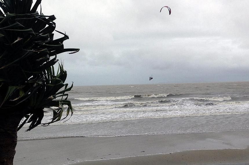 A kitesurfer makes the most of strong winds and choppy seas caused by Cyclone Marcia, near Yeppoon, central Queensland, Australia, Feb 19 2015. -- PHOTO: EPA