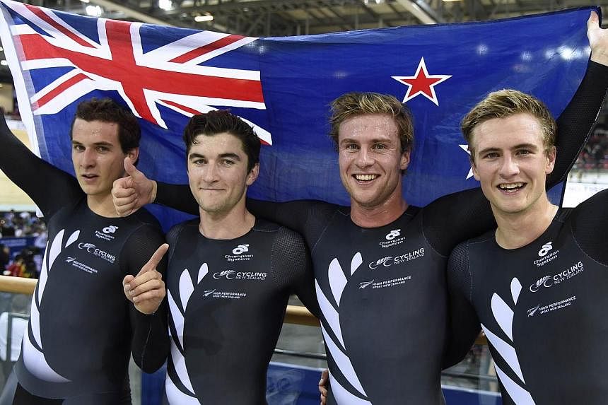Members of the New Zealand team (from left) Marc Ryan, Dylan Kennett, Pieter Bulling, and Alex Frame pose after winning the Men's Team Pursuit Final at the UCI Track Cycling World Championships on Feb 19, 2015. -- PHOTO: AFP&nbsp;