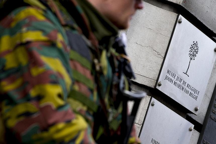A Belgian soldier guards the entrance of the Jewish museum in central Brussels Jan 18, 2015.&nbsp;&nbsp;A Frenchman suspected of helping compatriot Medhi Nemmouche, held for killing four people at the Brussels Jewish Museum in May, has been formally 