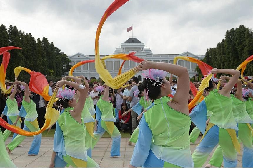 Dancers from the SOKA Sunflower Dance Ensemble peform at the Istana Lawn during the Chinese New Year open house at the Istana on Feb 20, 2015. -- PHOTO: MARK CHEONG