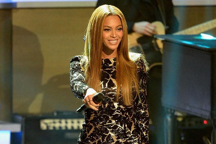 Recording artist Beyonce performs onstage during Stevie Wonder: Songs In The Key Of Life - An All-Star Grammy Salute at Nokia Theatre LA Live on Feb 10, 2015, in Los Angeles, California. Unedited photographs showing pimples on Beyonce's face have app
