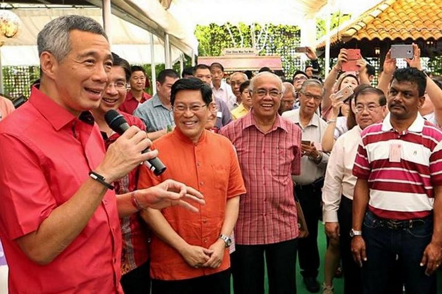 There was also plenty of festive cheer as Prime Minister Lee Hsien Loong (left) and his wife hosted a Chinese New Year open house at their home, just days after he underwent surgery to remove his prostate gland.&nbsp;-- PHOTO: FACEBOOK/ LEE HSIEN LOO