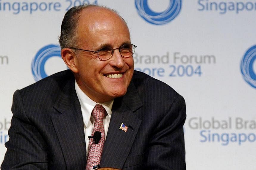 Former New York mayor Rudy Giuliani - above, in a 2004 file photo, during a trip to Singapore - has triggered a firestorm with an unflinching verbal assault on Barack Obama, saying the US President does not "love" America. -- ST FILE PHOTO