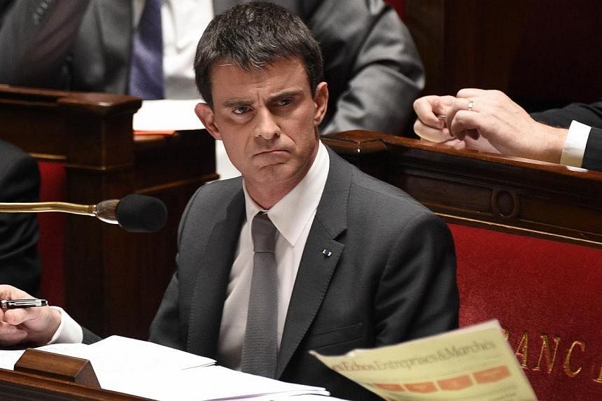 French Prime Minister Manuel Valls is pictured during the debate held prior to a parliamentary vote of no-confidence over the government's economic reforms, on Feb 19, 2015 at the French national Assembly in Paris. -- PHOTO: AFP