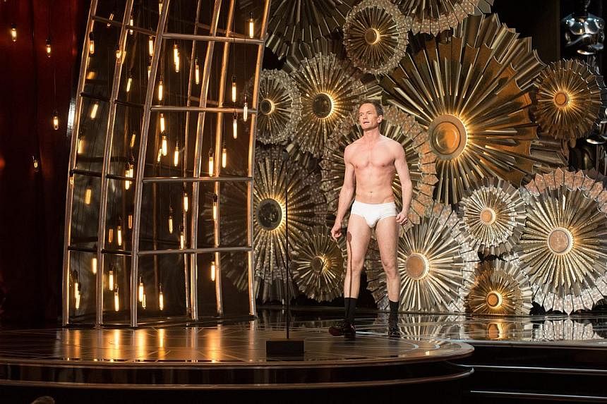TV ratings for the Oscars' US broadcast fell 16 per cent from last year amid lukewarm reviews and criticism for its first-time host Neil Patrick Harris. During the show, he stripped to his briefs in a skit about best picture winner Birdman. -- PHOTO: