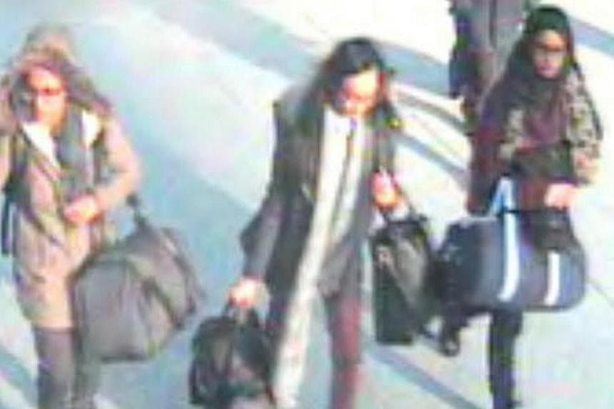 British teenage girls Amira Abase, Kadiza Sultana and Shamima Begun (left to right) walk through Gatwick airport before they boarded a flight to Turkey on Feb17, 2015, in this still handout image taken from CCTV and released by the Metropolitan Polic