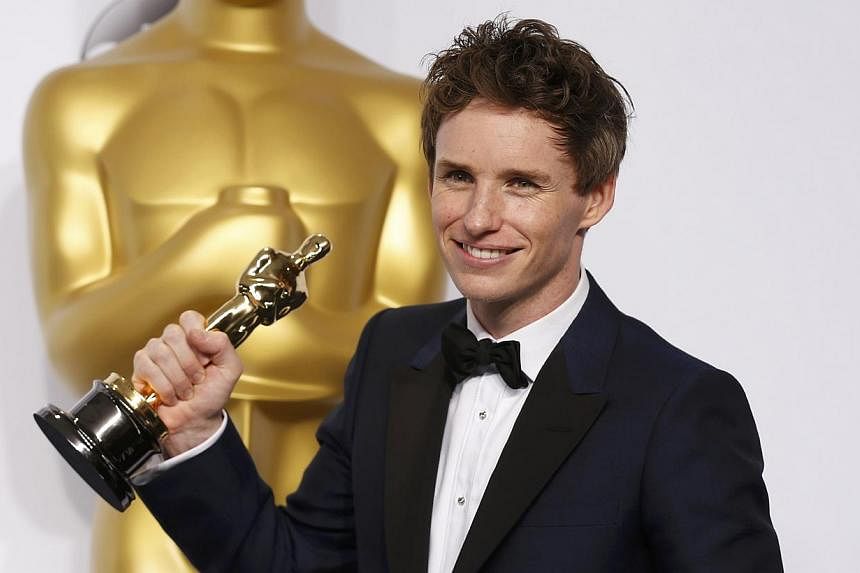 Eddie Redmayne poses with his Oscar for best actor nominee for his role in The Theory Of Everything at the 87th Academy Awards in Hollywood, California on Feb 22, 2015. -- PHOTO: REUTERS