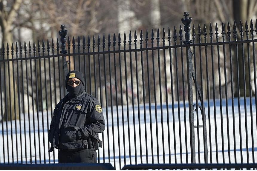 A member of the Secret Service standing outside the White House on Feb 23, 2015, in Washington, DC. A Department of Homeland Security shutdown grows increasingly likely with lawmakers fighting over funding for the US agency amid a standoff about Pres