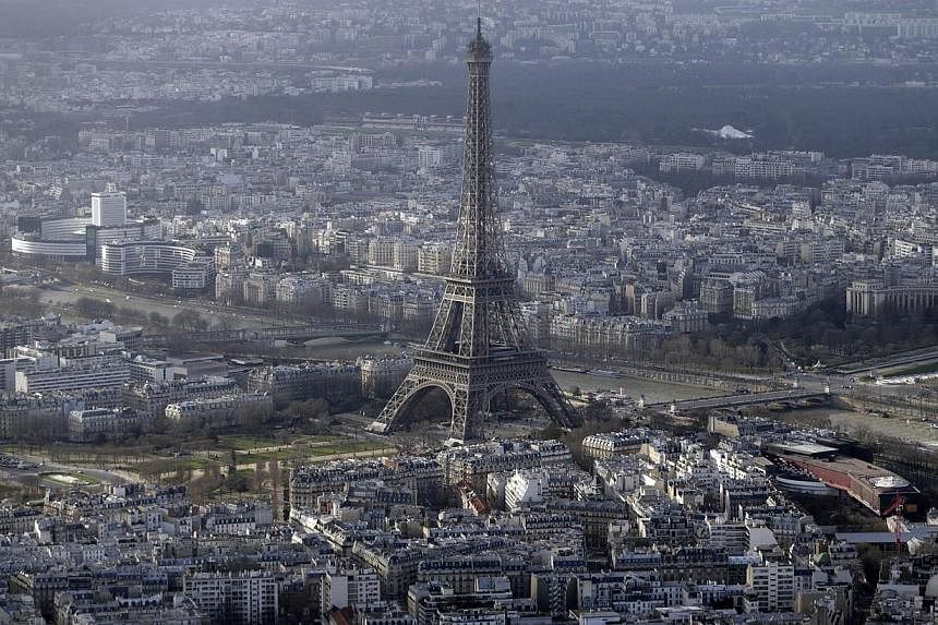 Drones have been spotted flying over central Paris landmarks, including the Eiffel Tower, at night. -- PHOTO: AFP