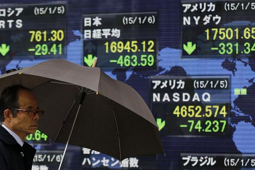 Asian stocks dropped as investors awaited details on Greece's package of economic measures and Federal Reserve Chair Janet Yellen's testimony to lawmakers. -- PHOTO: REUTERS