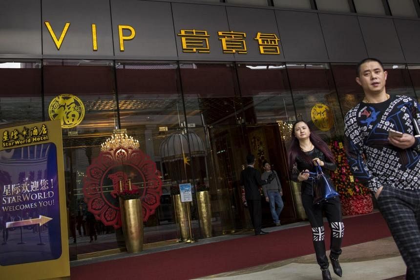 Mainland Chinese visitors leave from a VIP entrance at the Starworld Macau Casino in Macau on Feb 17, 2015. A senior Macau official said the city wants to study restrictions on mainland Chinese tourists to ease overcrowding. -- PHOTO: REUTERS&nbsp;