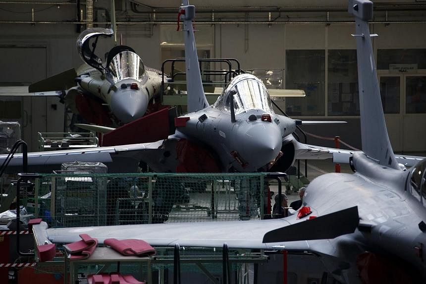 View of the assembly line of the Rafale jet fighter in the factory of French aircraft manufacturer Dassault Aviation in Merignac near Bordeaux, southwestern France. -- PHOTO: REUTERS
