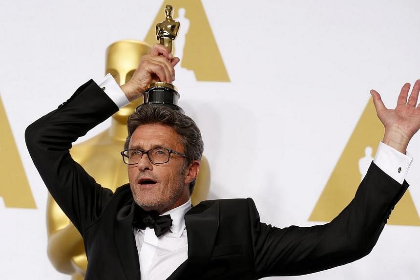 Filmmaker Pawel Pawlikowski, winner of the Best Foreign Language Film Award for Ida, poses in the press room during the 87th Annual Academy Awards at Loews Hollywood Hotel on Monday in California. -- PHOTO: AFP