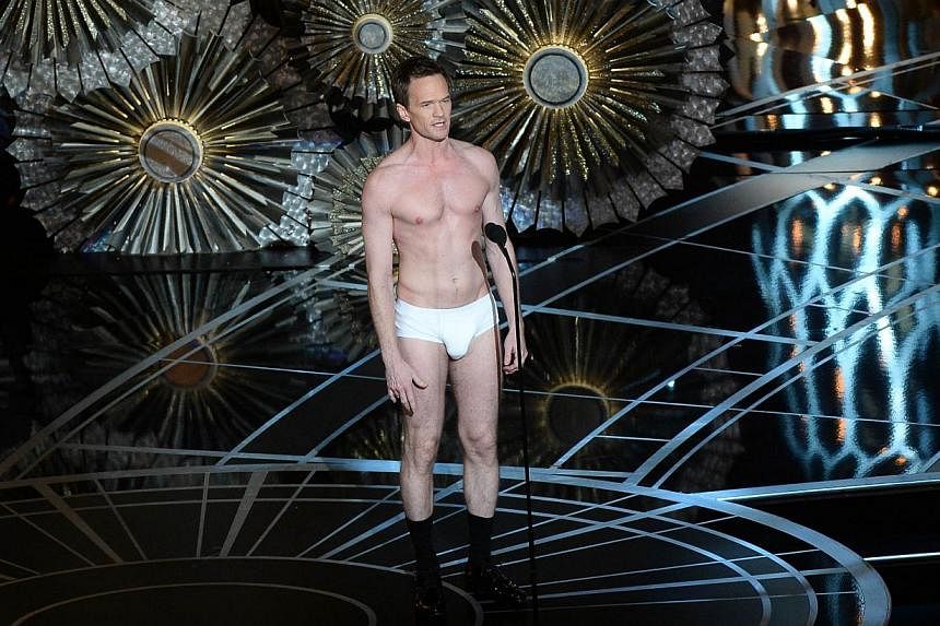 Host Neil Patrick Harris was caught with more than his pants down as critics slammed his bland, drawn-out routines and the telecast of the 87th Annual Academy Awards drew its smallest audience in six years. -- PHOTO: AFP