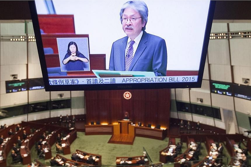 Hong Kong Financial Secretary John Tsang delivering the annual Hong Kong government Budget to the city's Legislative Council. -- PHOTO: EPA