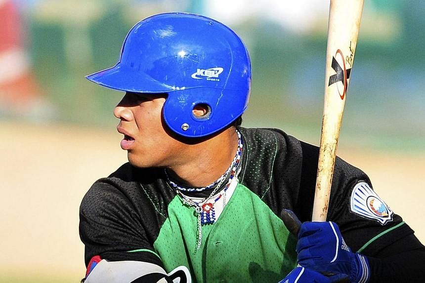 The Boston Red Sox have reportedly signed prized Cuban prospect Moncada, a switch-hitting infielder coveted by a host of Major League Baseball teams, to a record US$31.5 million (S$42.7 million) signing bonus. -- PHOTO: REUTERS