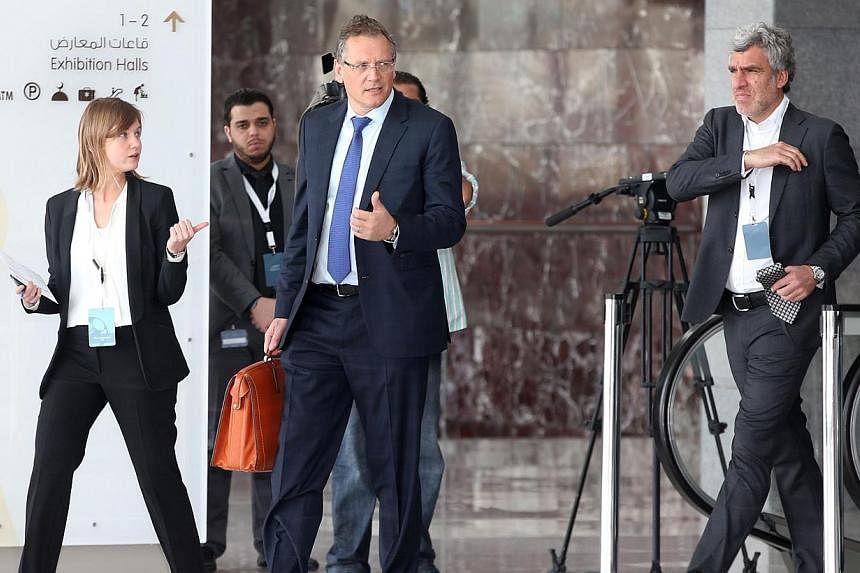 Fifa Secretary General Jerome Valcke (centre) arrives for a meeting in Doha on Feb 24, 2015, with the Fifa taskforce, including officials from football's global governing body, top leagues and players' representatives. -- PHOTO: AFP