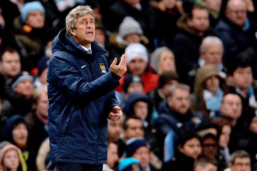 Manchester City manager Manuel Pellegrini reacts during the Uefa Champions League round of 16 first leg tie between Manchester City and Barcelona held at the Etihad Stadium in Manchester, Britain on Feb 24, 2015.&nbsp;Despite defeat by Barcelona, Pel