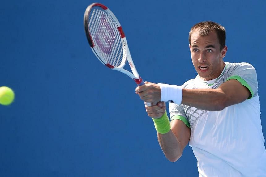 Czech Republic's Lukas Rosol plays a shot during his men's singles match against France's Kenny De Schepper on day one of the 2015 Australian Open tennis tournament in Melbourne on Jan 19, 2015. -- PHOTO: AFP