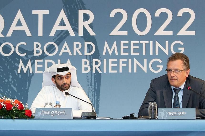 Fifa Secretary General Jerome Valcke (right) and head of the Qatar 2022 World Cup organising committee Hassan al-Thawadi give a press conference to defend the football's ruling body's controversial proposal to shift the 2022 World Cup from the normal