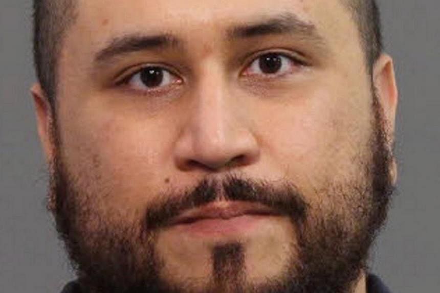 George Zimmerman is seen in a booking photo released by the Seminole County Sheriff's Department in Sanford, Florida on Nov18, 2013. -- PHOTO: REUTERS