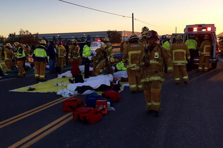 Passengers waiting to be attended to by medical personnel in this handout photo provided by Joe Garces after a double-decker Metrolink train derailment in Oxnard, California on Feb 24, 2015. -- PHOTO: REUTERS
