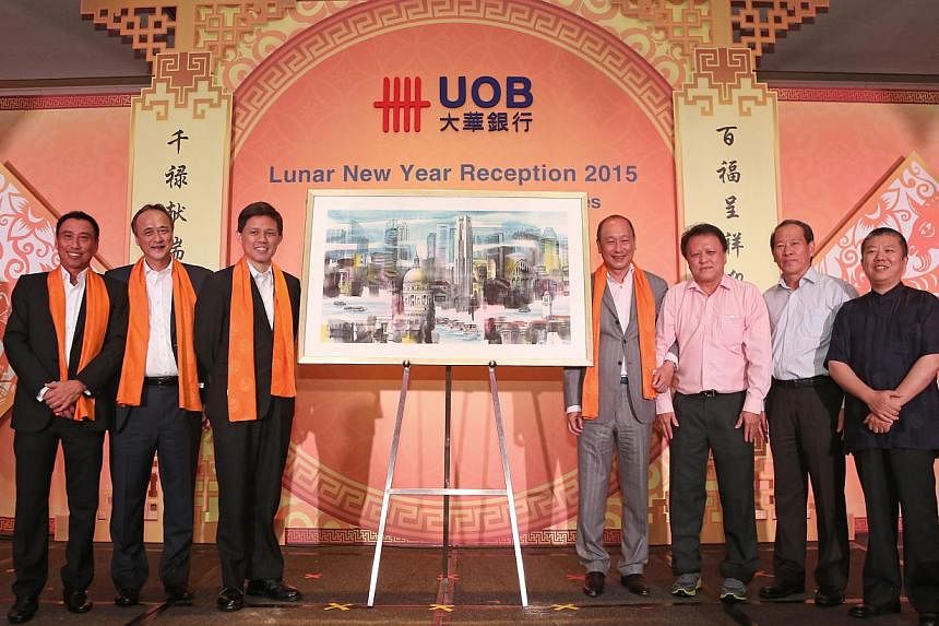 A brush of good luck at the UOB Commercial Banking Lunar New Year dinner. (From left) Mr Eric Tham, Managing Director, Group Commercial Banking, UOB Group, Mr Fred Chin, Managing Director, Group Wholesale Banking, UOB Group, Minister Chan Chun Sing, 