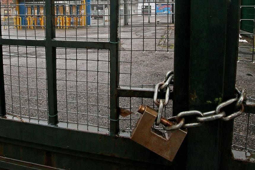 The entrance gates of the Ennio Tardini stadium in Parma are padlocked Feb 22, 2015 ahead of the scheduled Serie A soccer match against Udinese. The match has been called off because the bank account of bankruptcy-threatened Parma is reported to be a
