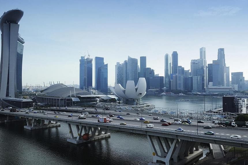 Singapore's Budget 2015 announcement on higher tax allowances for mergers and acquisitions is heartening. It is now easier for SMEs to gain opportunities for significant inorganic growth. -- PHOTO: BLOOMBERG
