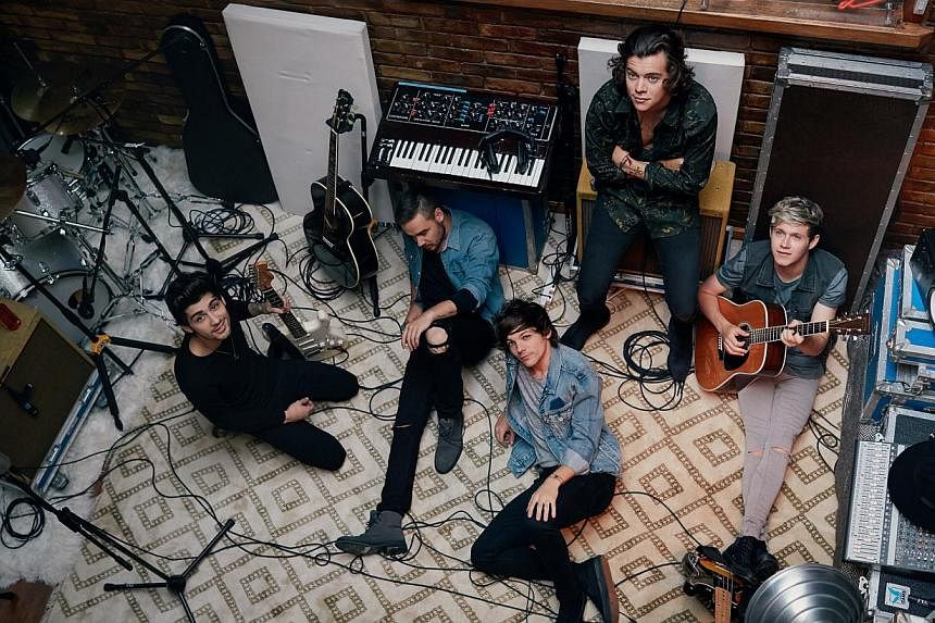 (From left) Zayn Malik, Liam Payne, Louis Tomlinson, Harry Styles and Niall Horan make up One Direction, the top British act for the third year running. -- PHOTO: SONY MUSIC