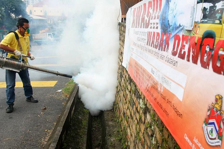 A worker carrying out fogging in mosquito breeding areas in Kuala Lumpur. Malaysia's Health Ministry is trying outdoor spraying of a deltamethrin-based insecticide to kill Aedes mosquitoes in view of the record high number of dengue fever cases recen