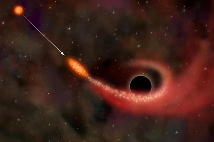 This file image is an artist's illustration of the destruction of a star that&nbsp;wandered too close to a supermassive black&nbsp;hole.&nbsp;Astronomers said Wednesday they had detected an "impossibly large" and ancient black hole that challenges th