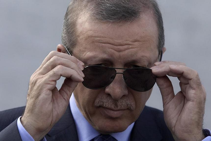 Turkish President Recep Tayyip Erdogan (above) on Wednesday mocked men who wear skirts, in an apparent jibe at activists who wore female clothes at the weekend in a protest supporting women's rights. -- PHOTO: REUTERS