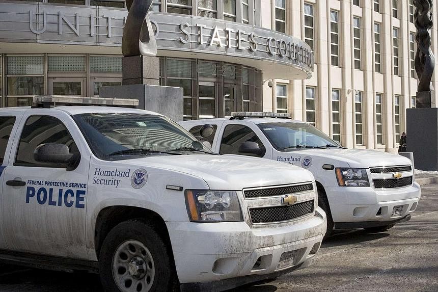 Federal Protective Service vehicles, which is a branch of Homeland Security, park outside the US District Courthouse in the Brooklyn borough of New York February 25, 2015. Senate Democrats on Wednesday agreed to a Senate Republican plan to avert a pa