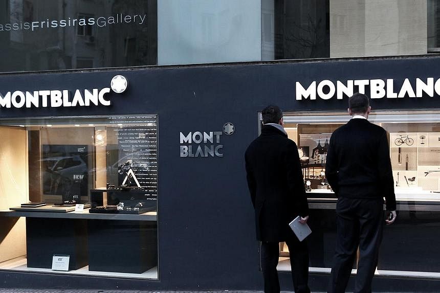 Luxury marque Montblanc is to sell fountain pens made from a "miracle pine" tree that survived the 2011 tsunami, for a hefty US$4,400 (S$5,963), an official said, with just 20 per cent of takings donated to local people. -- PHOTO: REUTERS