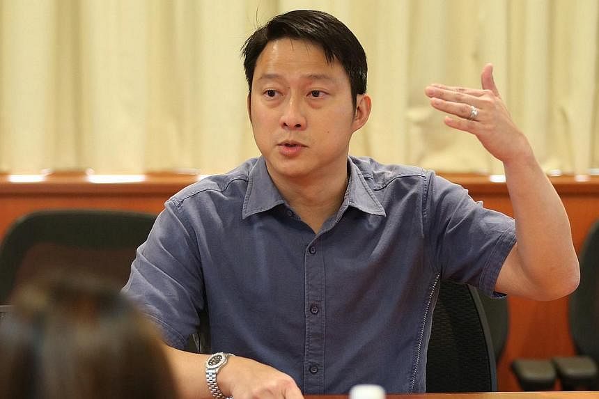 People's Action Party (PAP) MP Lam Pin Min (above) has been accused of making racially seditious comments by film-maker Martyn See, who has made a police report against the MP on Thursday. -- ST PHOTO:&nbsp;NEO XIAOBIN