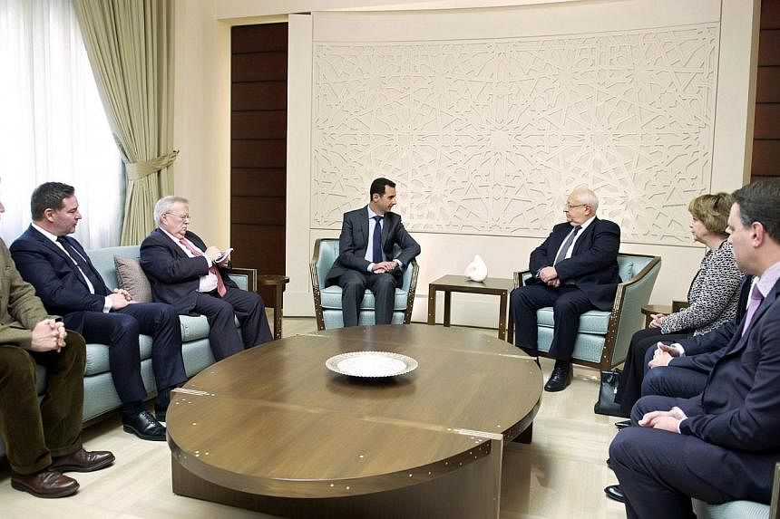 A handout picture released by the Syrian Arab News Agency (SANA) on Feb 25, 2015, shows Syrian President Bashar al-Assad (centre, left) meeting with French socialist senator, Jean-Pierre Vial (centre,right), along with three other French parliamentar