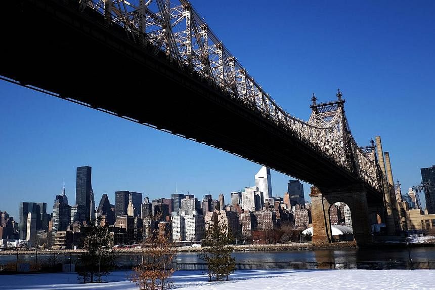 The skyline of New York's Midtown Manhattan is pictured from under the Queens Bridge on Feb 25, 2105 in New York. Three New York residents from Kazakhstan and Uzbekistan have been arrested for allegedly trying to join the Islamic State group fighting