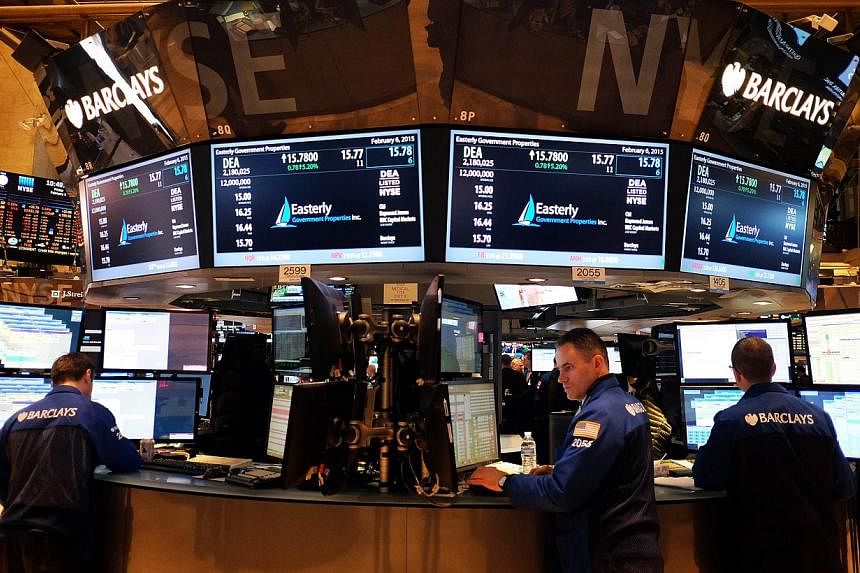 Traders work on the floor of the New York Stock Exchange (NYSE) on February 6, 2015, in New York. -- PHOTO: AFP
