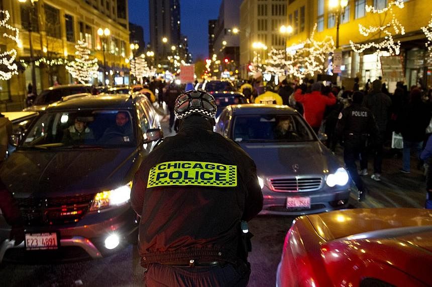 Protesters clash with the Chicago police following grand jury decisions regarding police-involved deaths on Dec 7, 2014 in Chicago, Illinois.&nbsp;Police in the US city of Chicago on Wednesday denied a newspaper report alleging that they hold suspect