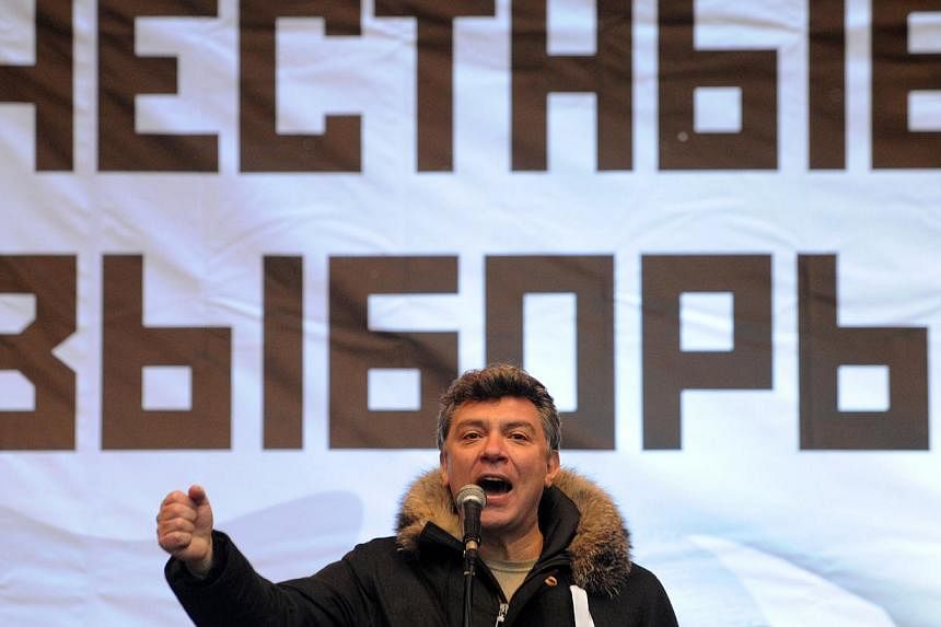 A picture take on December 24, 2011 in Moscow shows one of the leader of the opposition Boris Nemtsov speaking during a rally against the December 4 parliament elections in Moscow. -- PHOTO: AFP