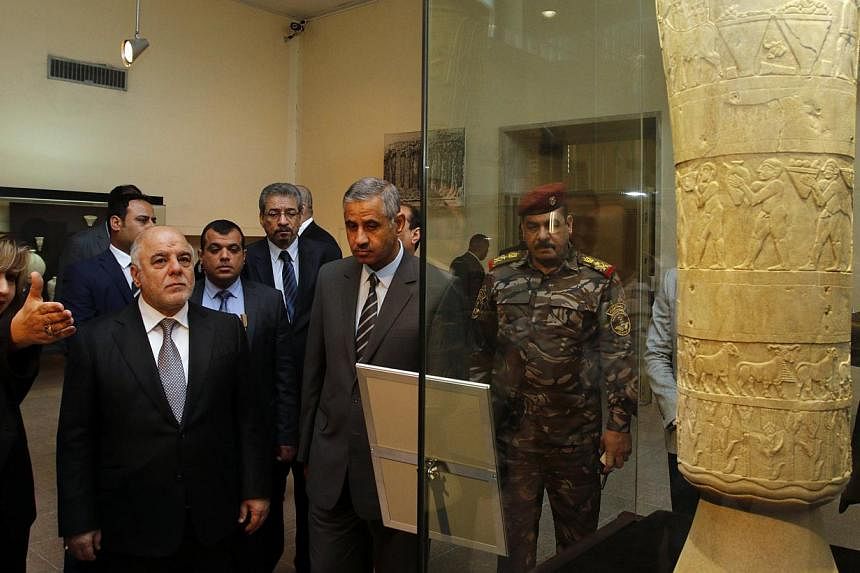 Iraqi Prime Minister Haider al-Abadi (second from left) visits the Iraqi National Museum in Baghdad on&nbsp;Feb 28, 2015. Iraq's national museum officially reopened on&nbsp;Saturday after 12 years of painstaking efforts during which close to a third 