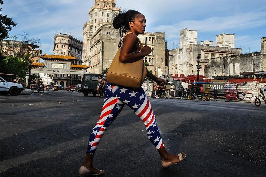A woman wearing leggings with the US flag design, walks in Havana on Jan 23, 2015.&nbsp;The United States said Friday it could reopen its embassy in Havana before a high-profile summit of the Americas in April, but cautioned "serious disagreements" r