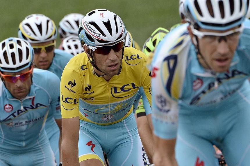 The UCI world cycling federation on Friday called for the withdrawal of the racing licence for the Astana team of Tour de France winner Vincenzo Nibali over doping accusations. -- PHOTO: AFP